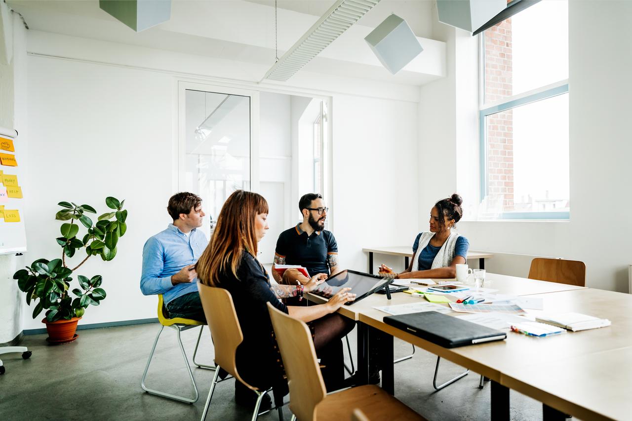 An image showing a group of people discussing on how to control financial risks