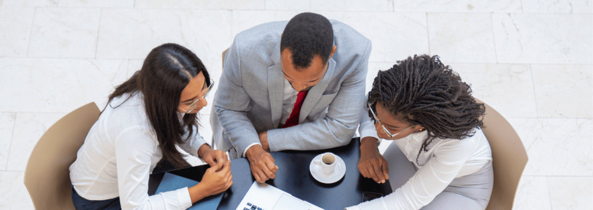 three-people-with-cofee-and-laptop
