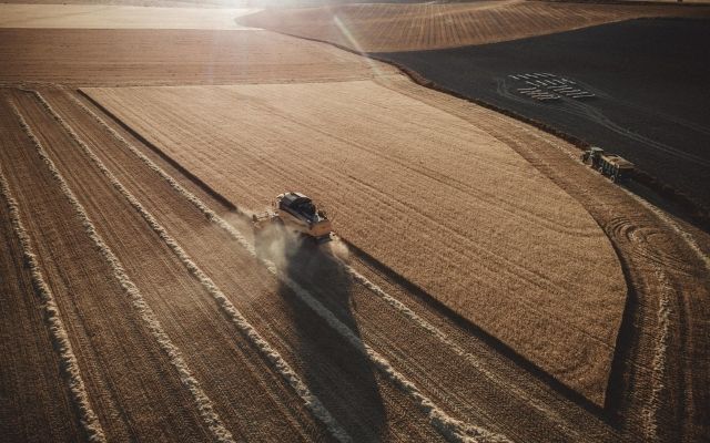 tractor in an open corn field 
