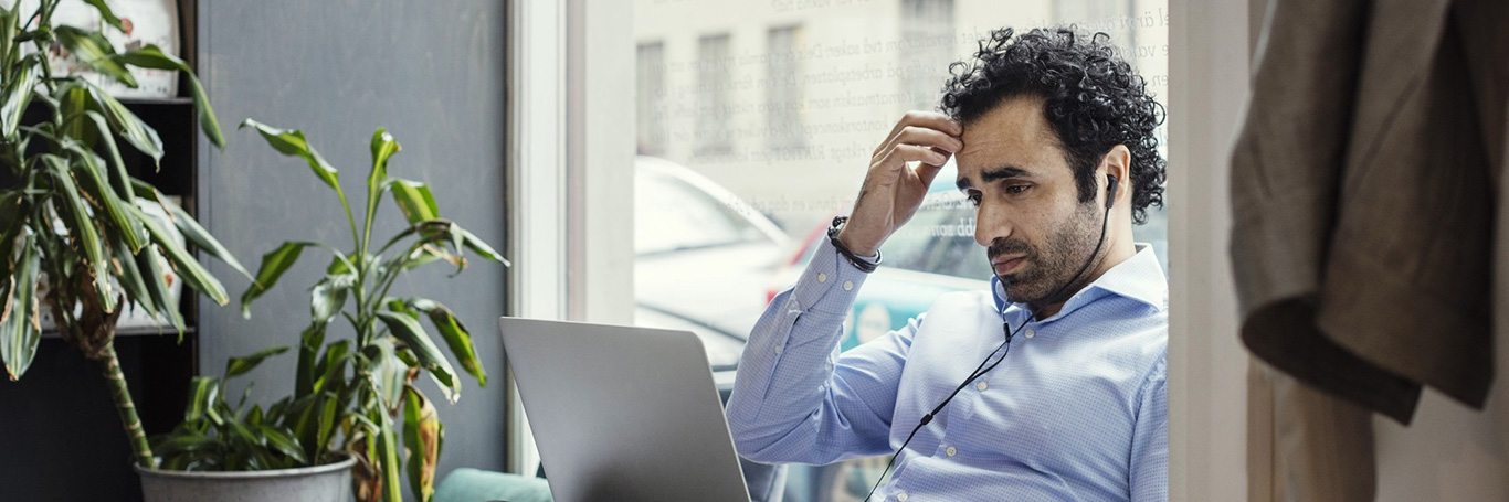 An image showing a person worried about cash flow problems
