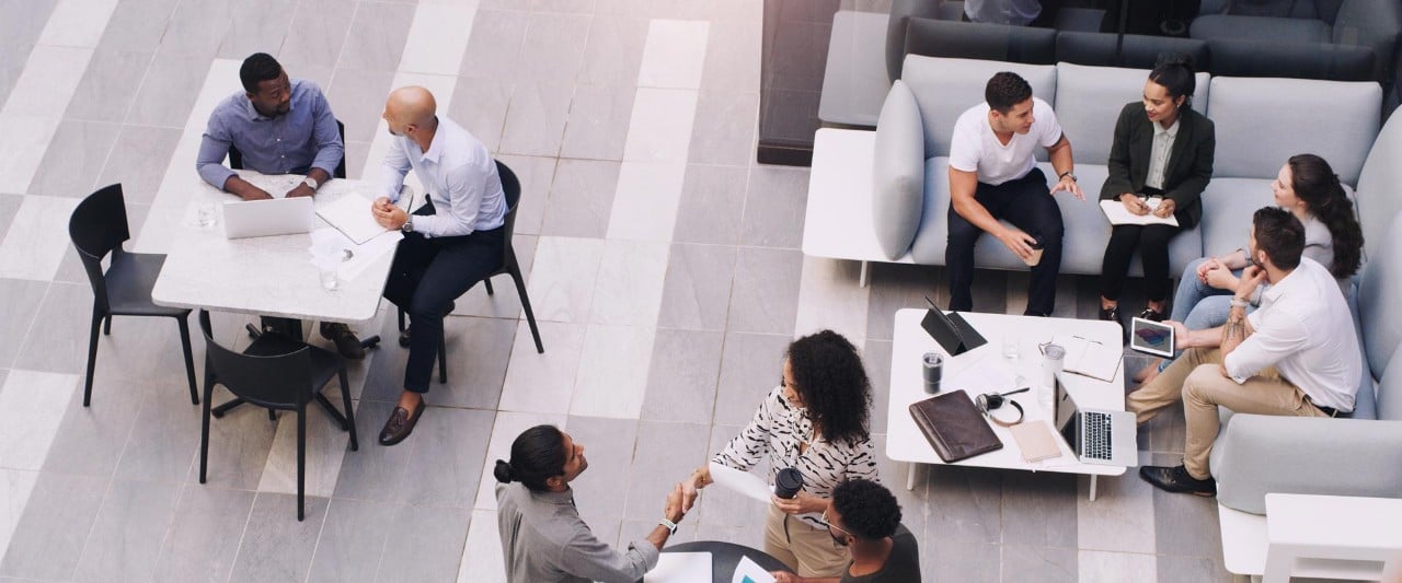 Corporate top view and business people talking in office lobby