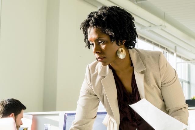 businesswomen at an office desk