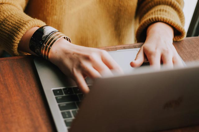 man in front of the laptop