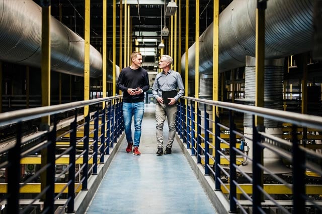 two man in the factory