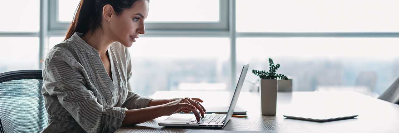 a woman is using the laptop