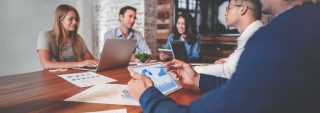a group of people disucssing business growth
