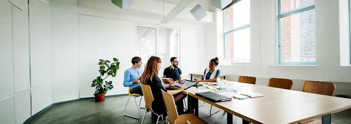 An image showing a group of people discussing on how to control financial risks