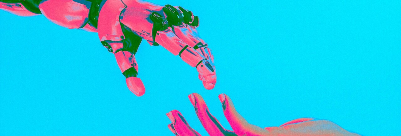 one robotic hand is getting in touch with a human hand