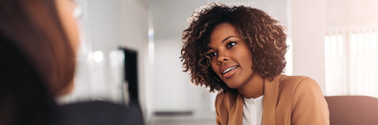 A woman talking to another woman