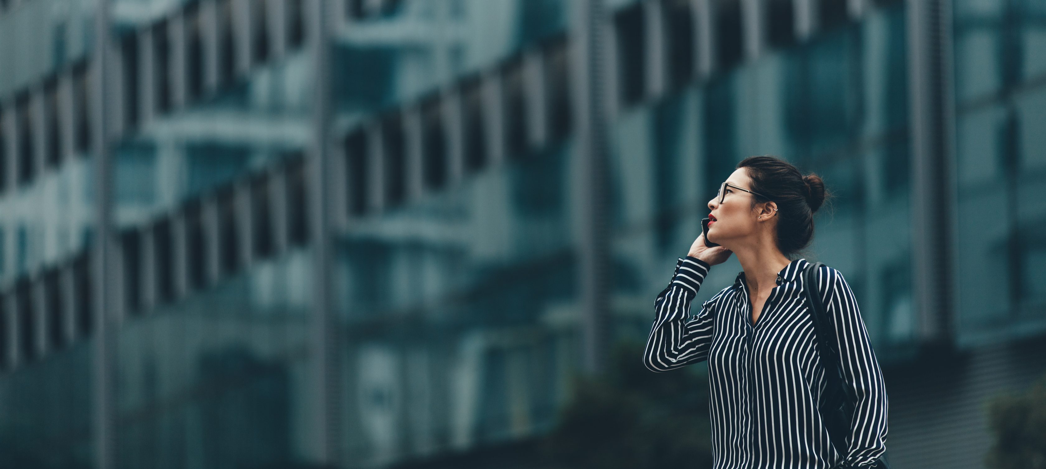 a woman talking on mobile about insolvency risk