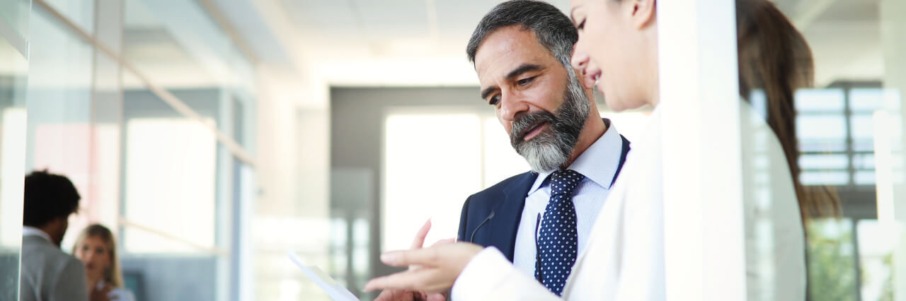 Man and women talking about business