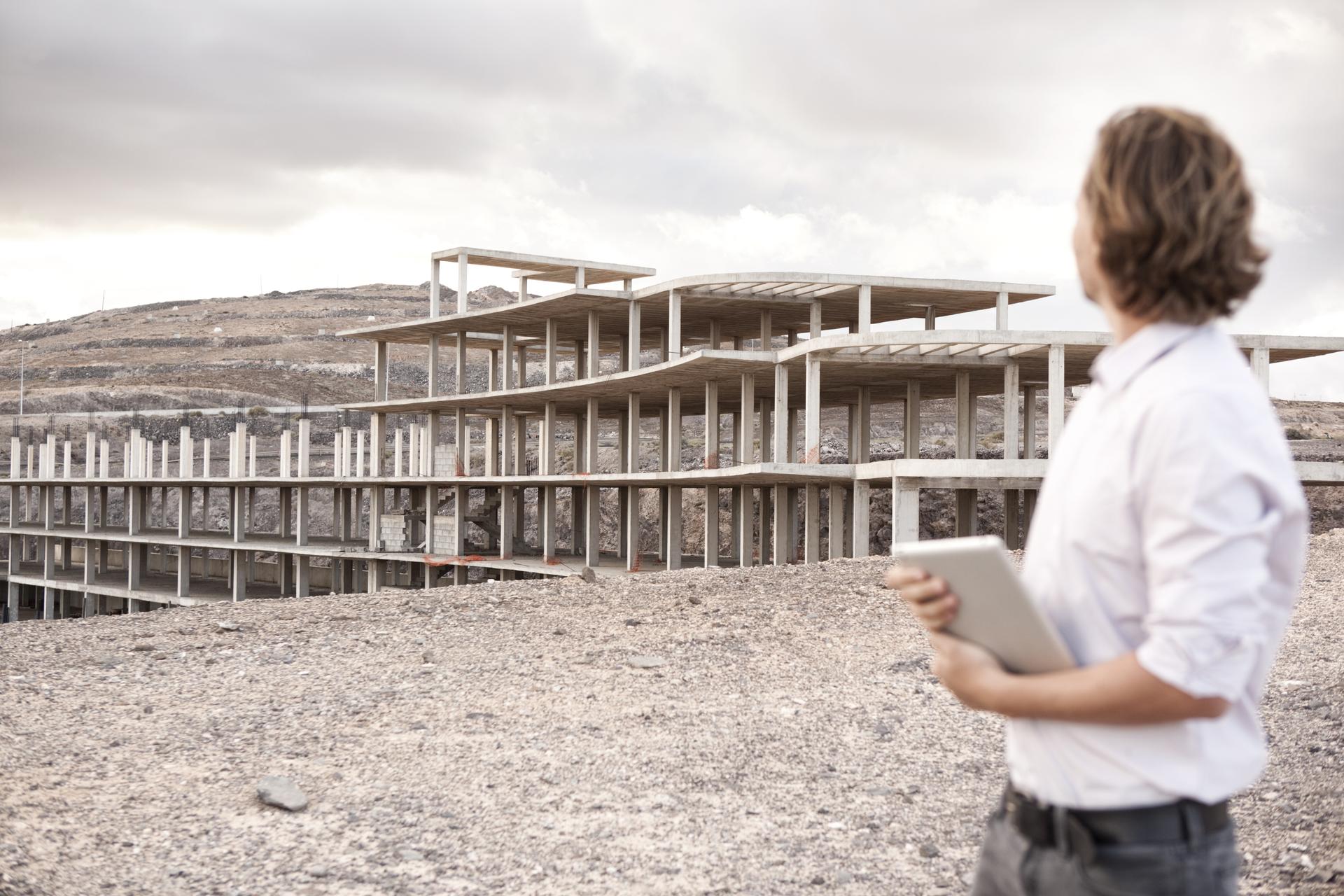 man-looking-at-building