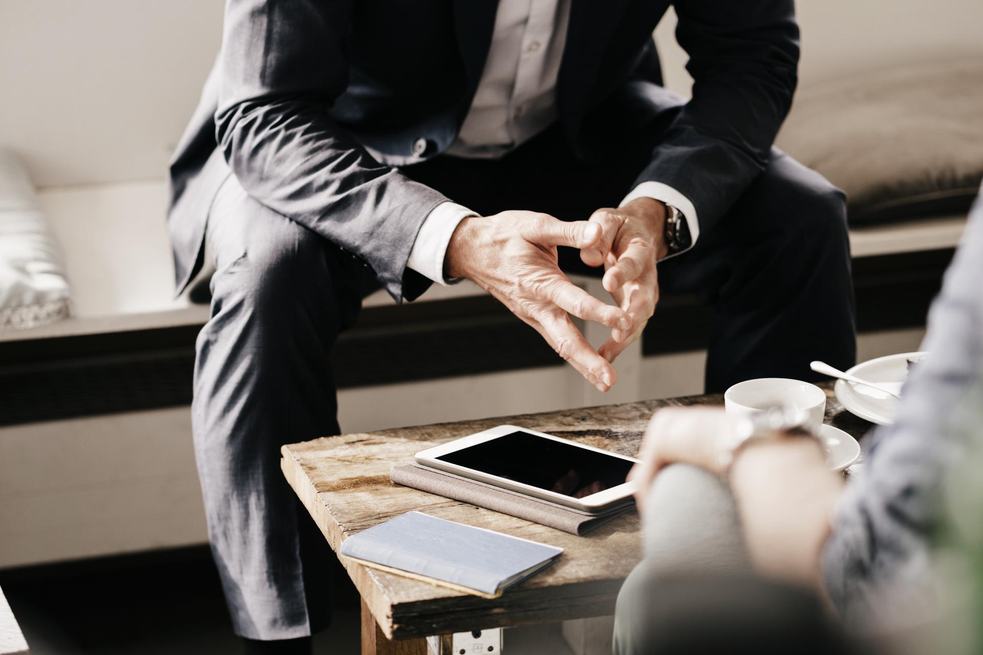 people-in-suits-having-meeting