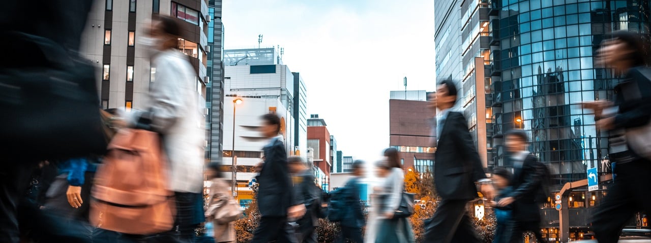 people walking on a street in Asia