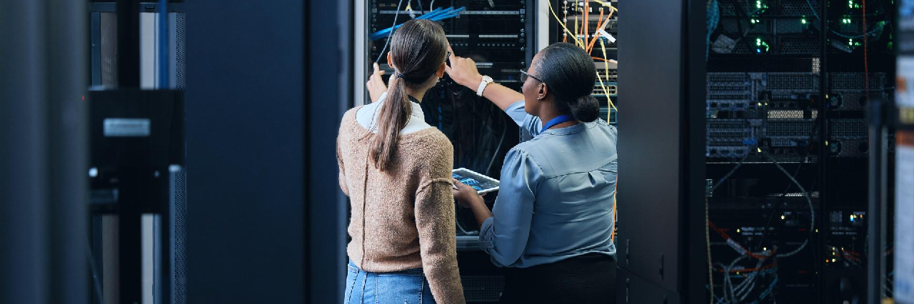 two-women-checking-host-computers