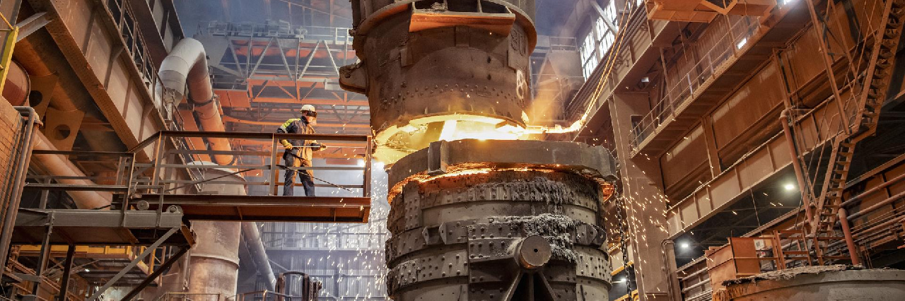 worker working with fire in factory hero