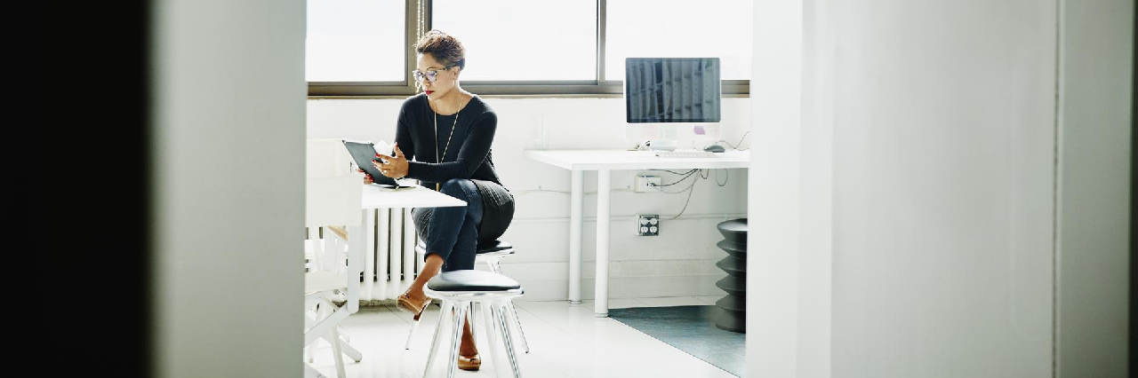 woman looking at tablet hero