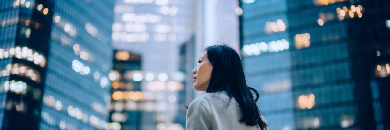 A-woman-is-in-front-of-building