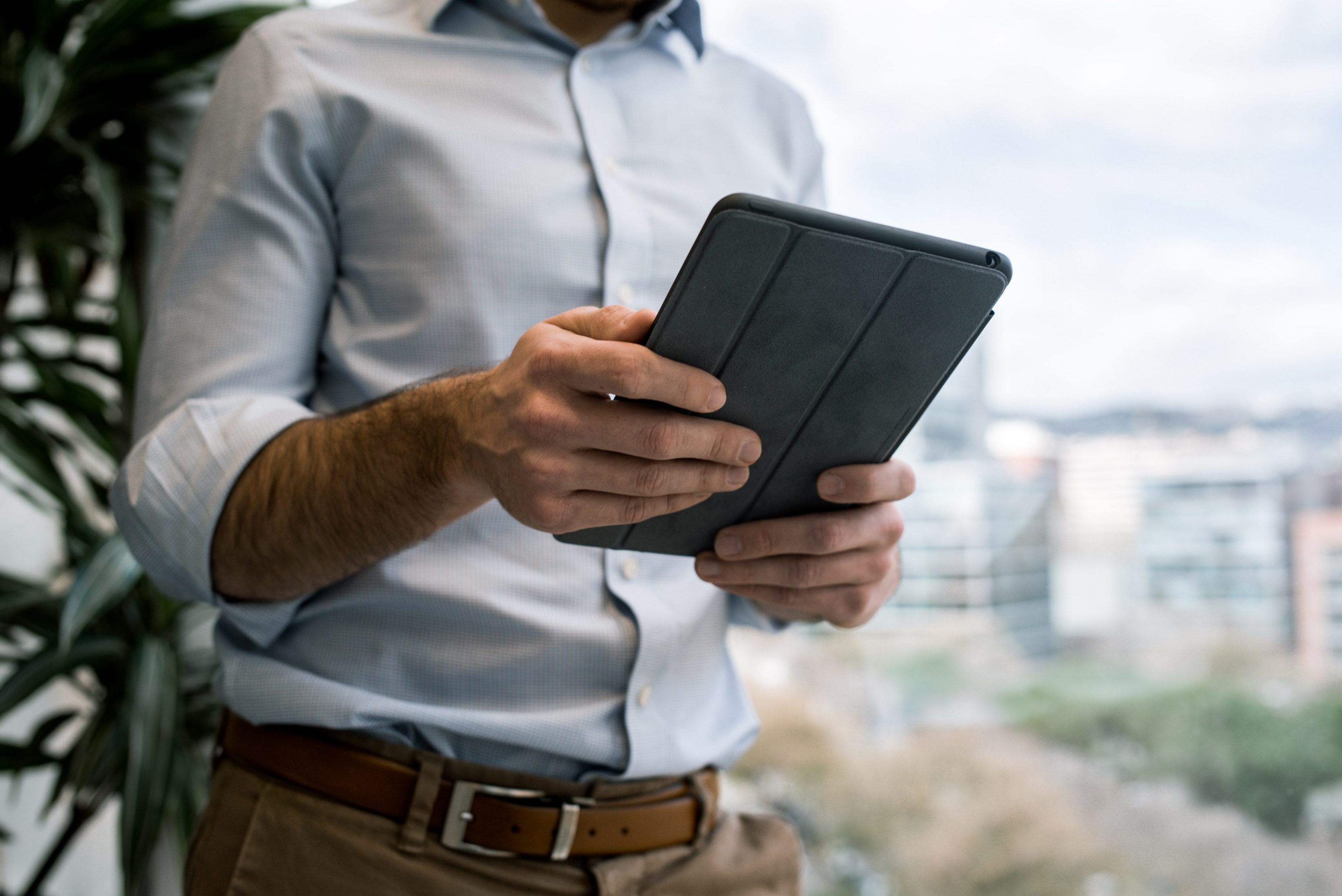 man with tablet in hand