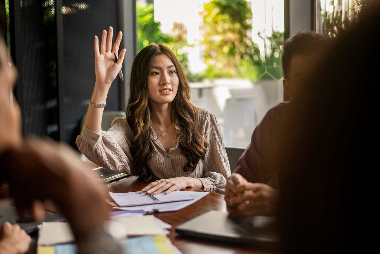 woman raising her hand