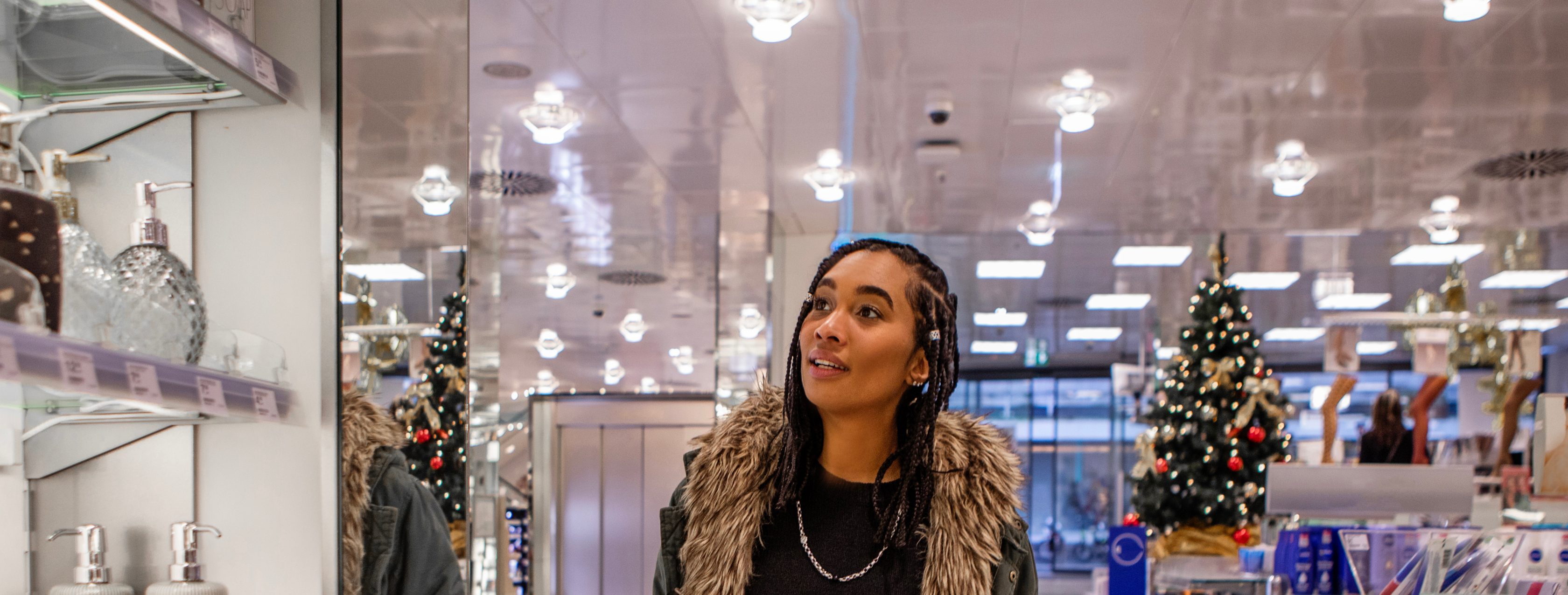 woman shopping in department store during holiday season