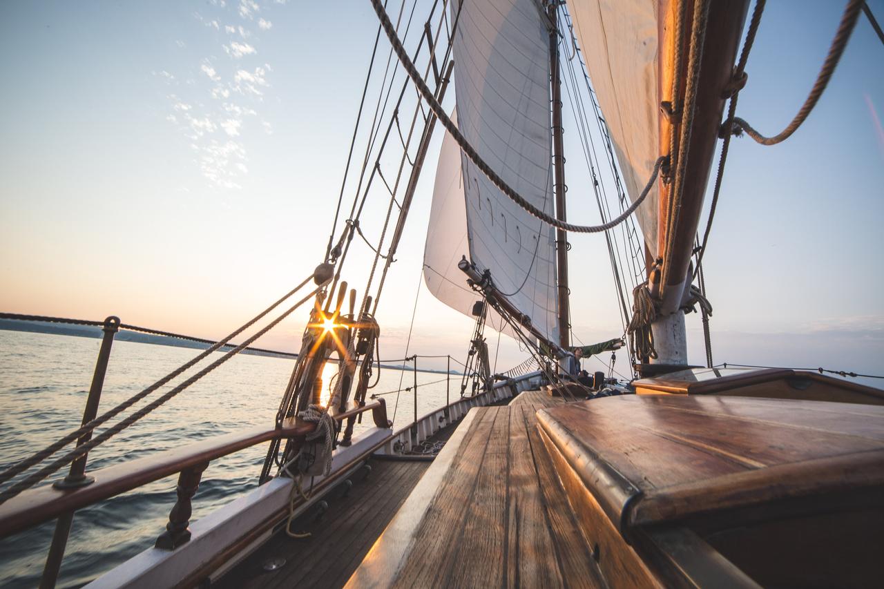 Sailboat With Sunset in Background