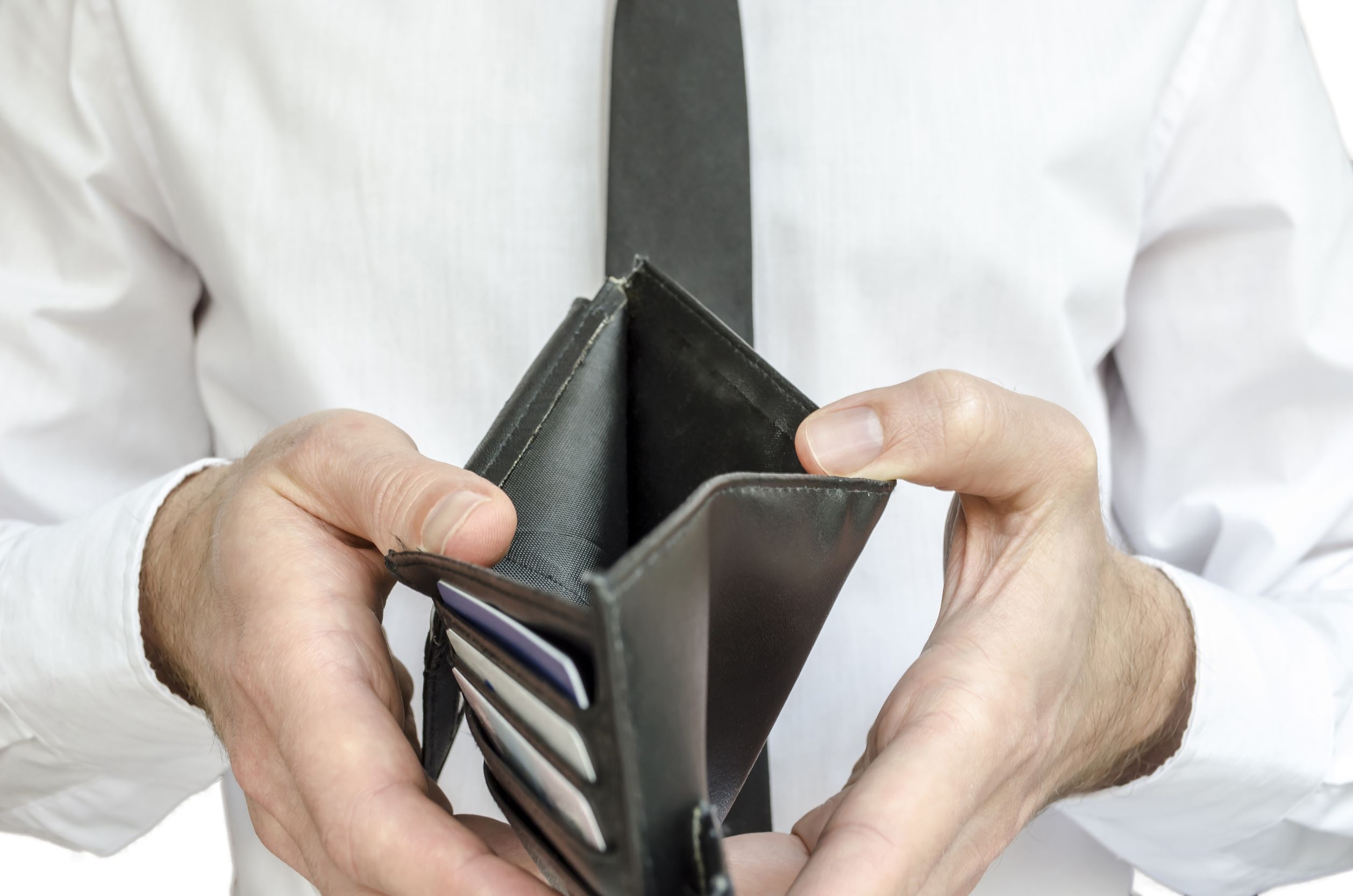 Man holding open empty wallet