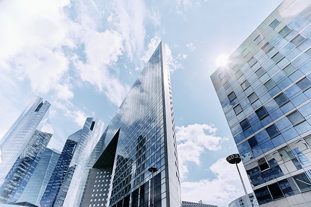 City Skyline with Skyscrapers with clouds and sun in background
