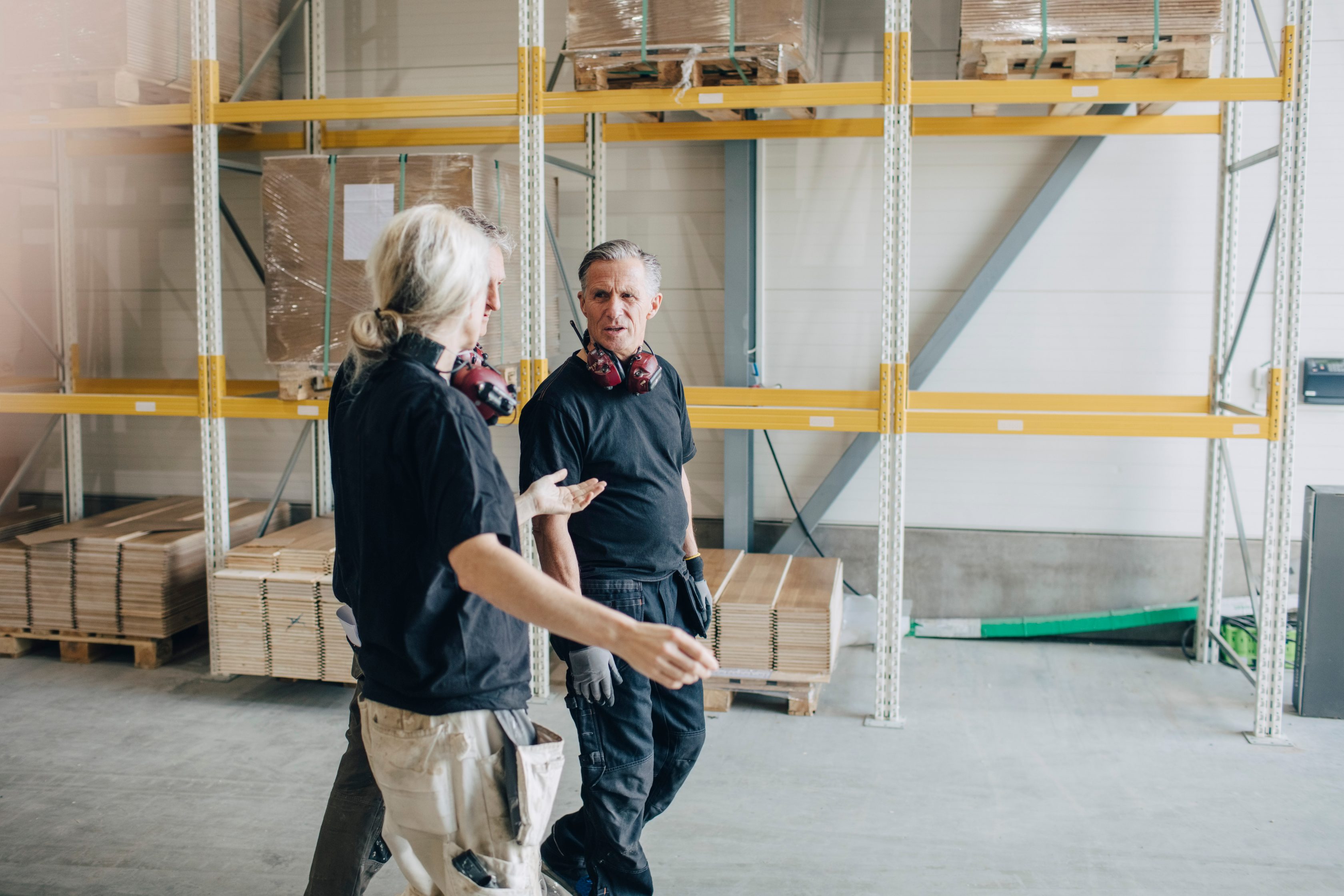 Workers talking in warehouse