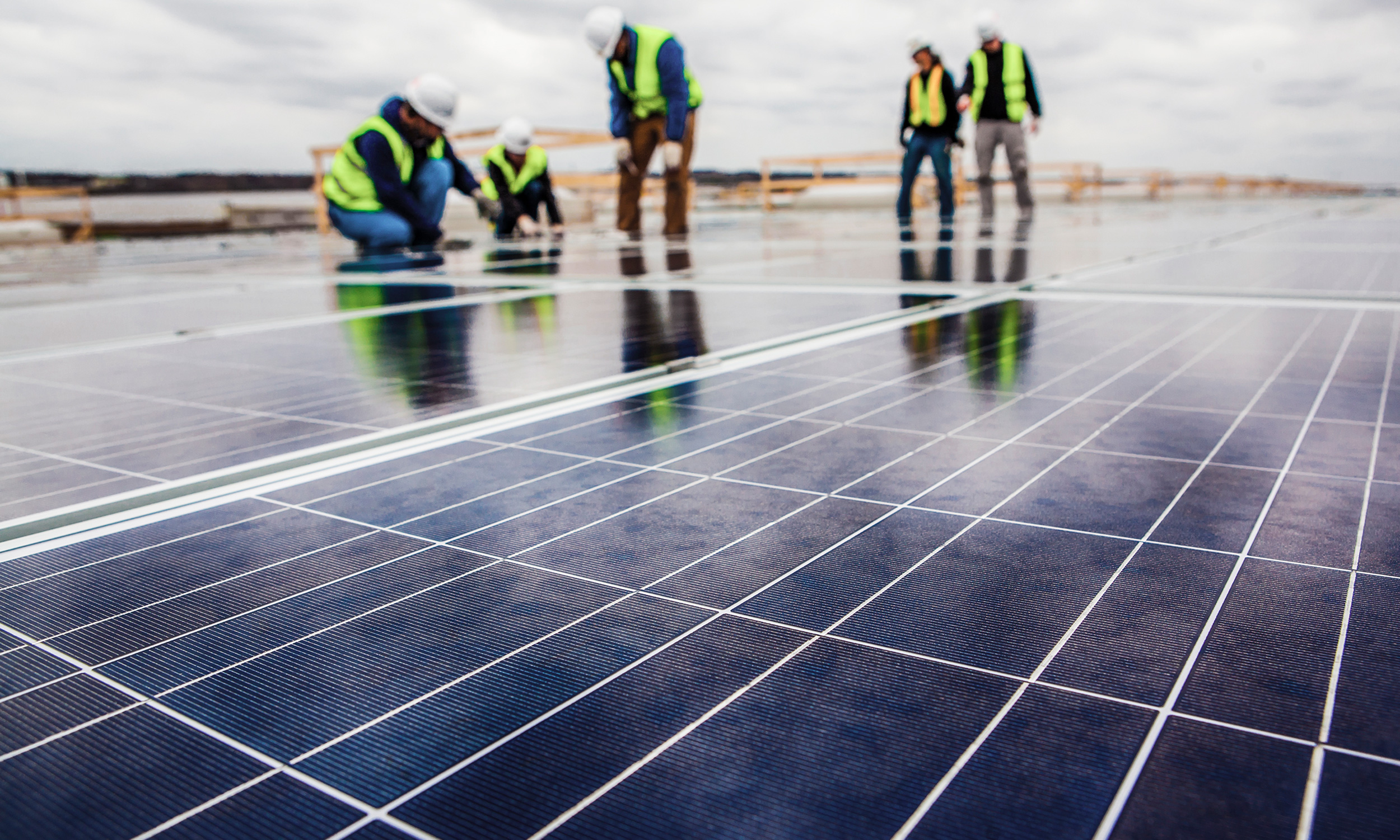 workers and solar panels
