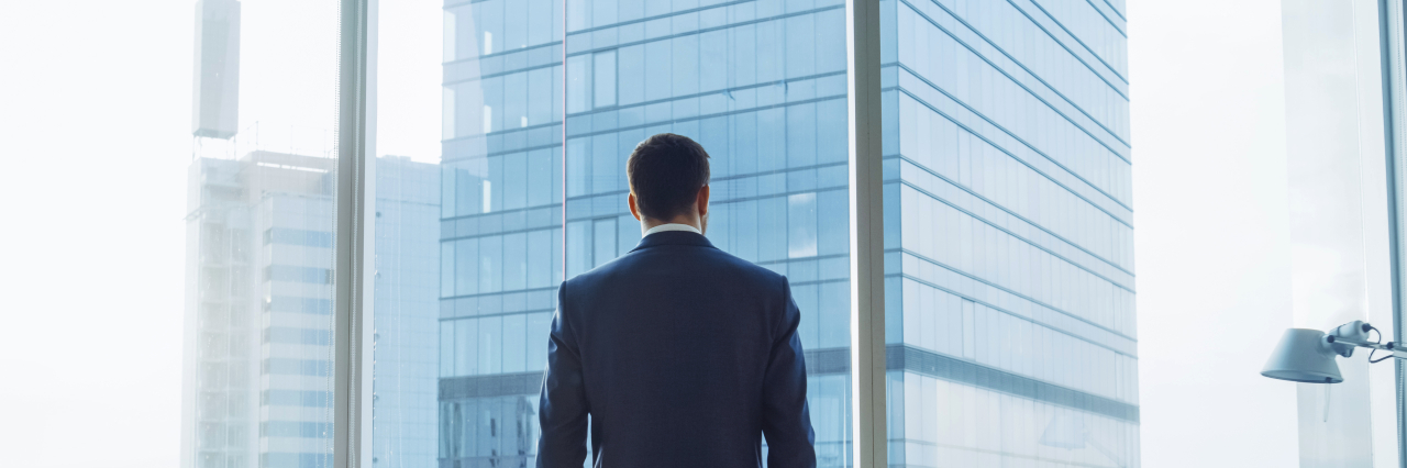 An image representing a man thinking about  the worst-case scenarios of credit risk