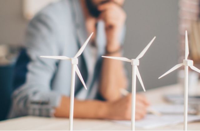 An engineer studying wind turbine models