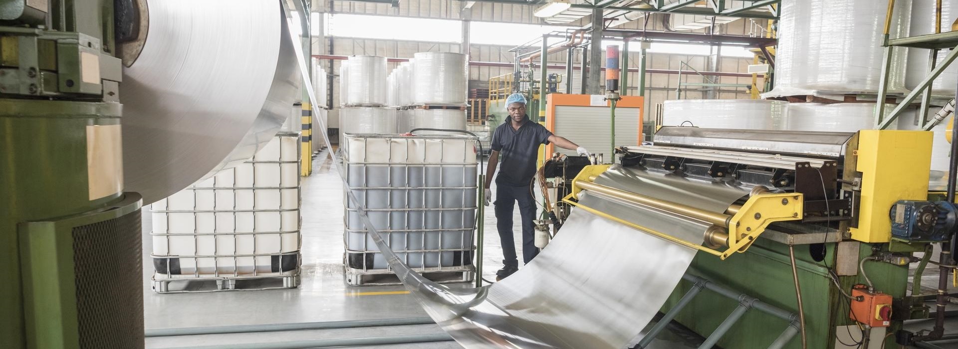 Man working in aluminium processing industrial building