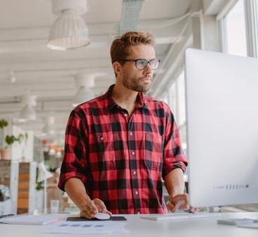 man-working-on-a-computer-in-modern-workplace