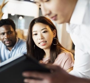 two-people-looking-at-a-tablet
