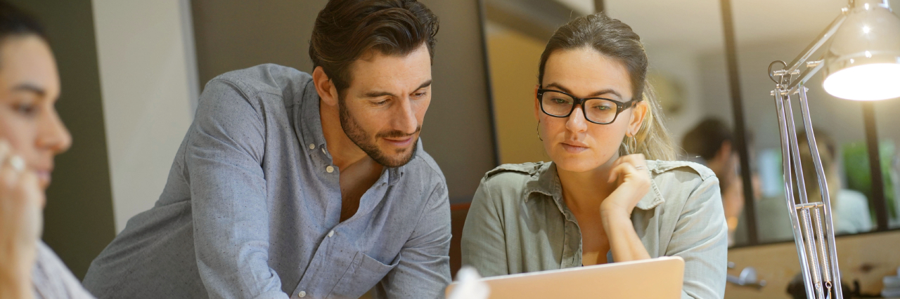 An image of two people discussing credit management solutions