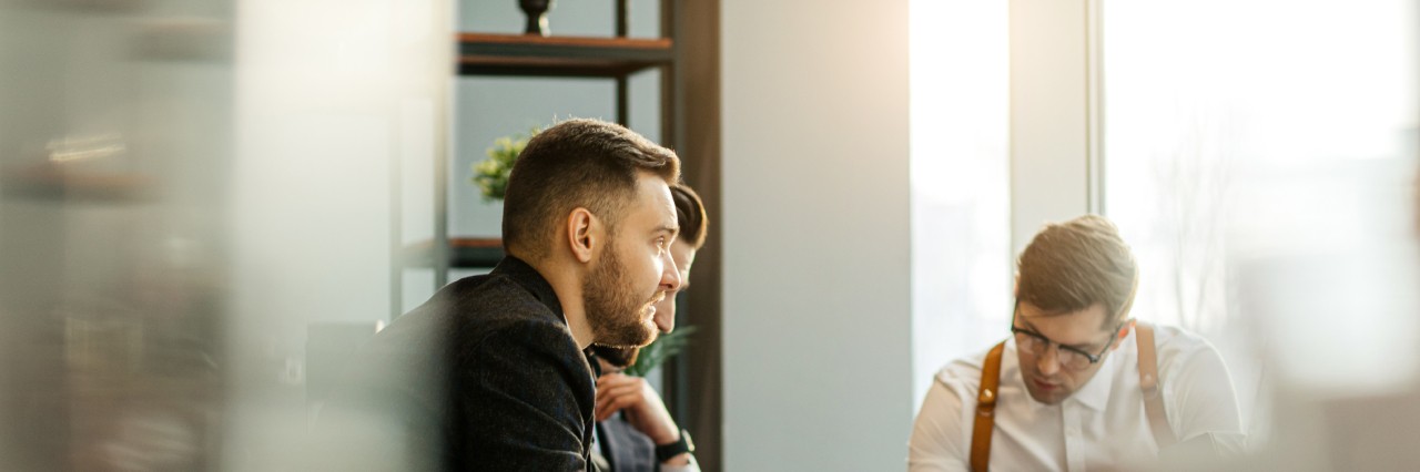 men in a meeting talking