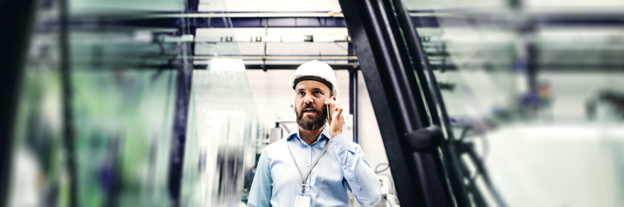 An image showing a person discusssing over phone about preventing insolvency risk