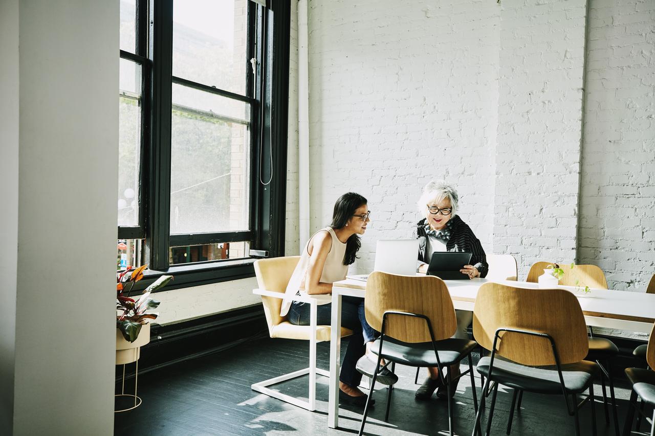 An image showing a couple of people discussing how to resolve a disputed invoice