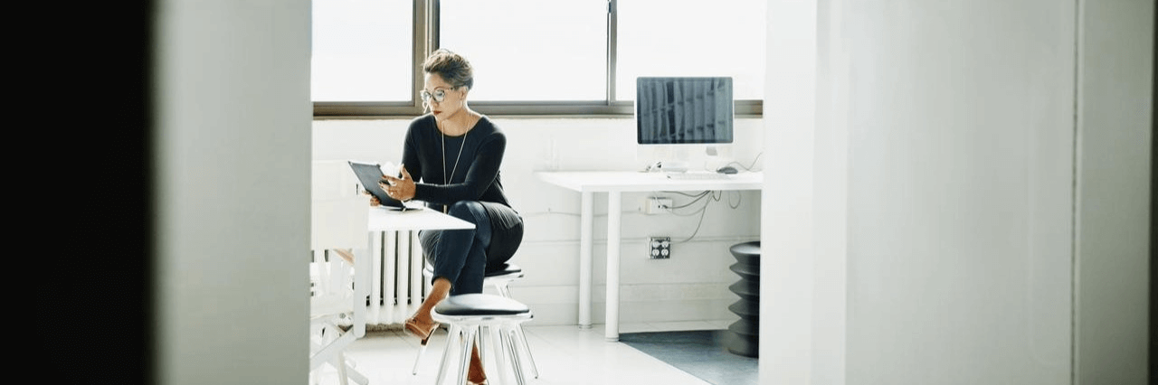 An image showing a person reading about online payment deferral