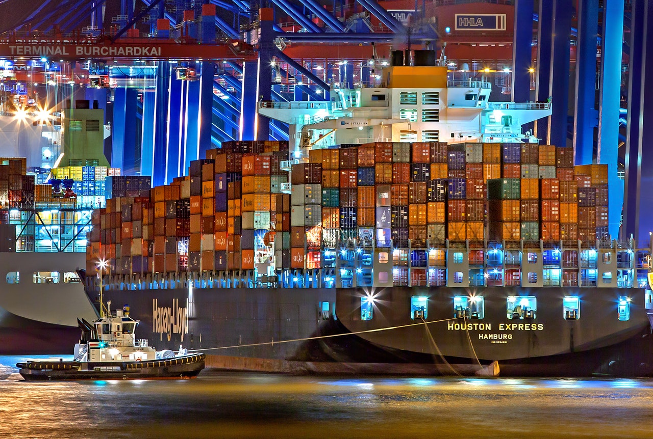 Boat with containers at night
