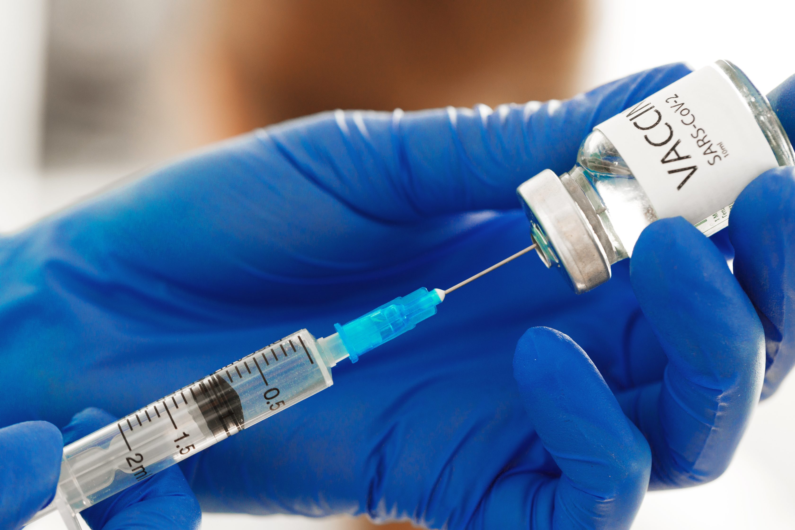 Doctor preparing a vaccine