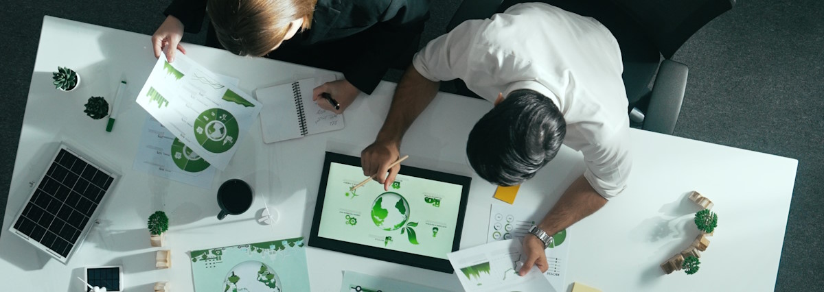 2 office clerks working on a csrd project