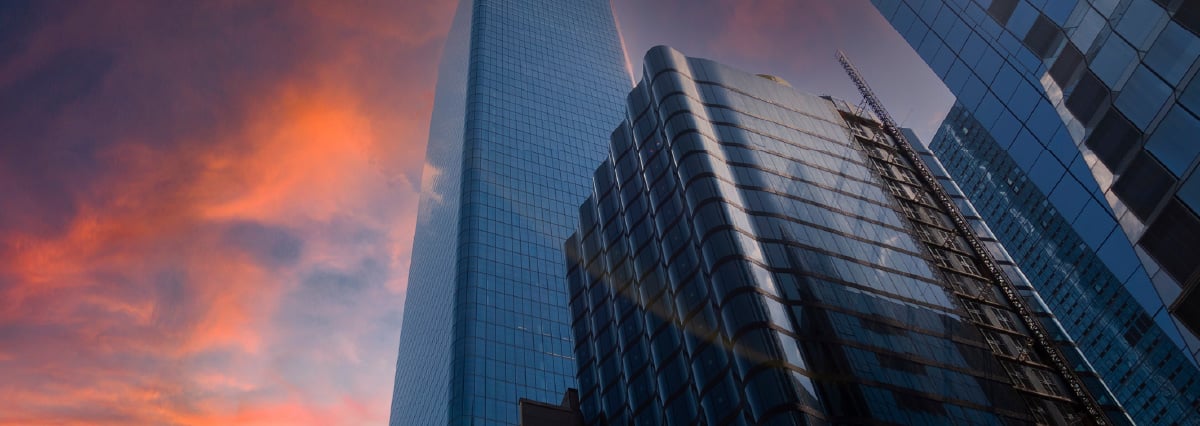 skyscrapers in front of a sunset sky