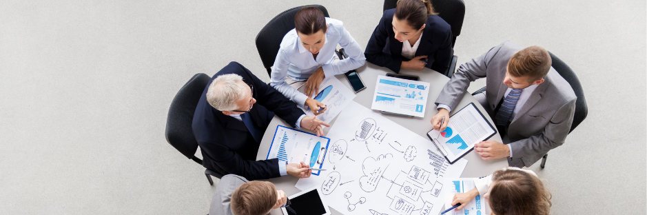 business-team-with-scheme-meeting-and-discussing-problem-at-office