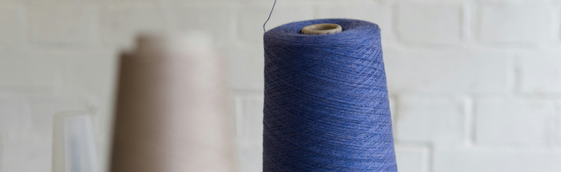 a woman tasting coffee